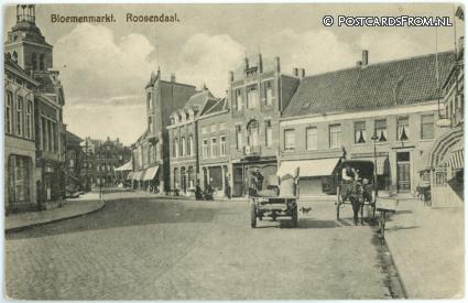ansichtkaart: Roosendaal, Bloemenmarkt. Mantelmagzijn 'De Vlijt'